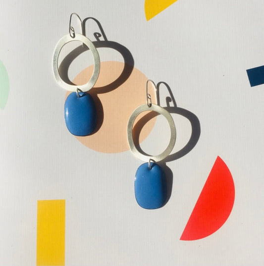 Silver hoop earrings with blue enamel drop
